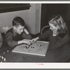 Boy and girl playing Chinese checkers. Eufaula, Oklahoma