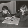 Boy and girl playing Chinese checkers. Eufaula, Oklahoma