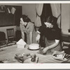 Wife of Jaycee member cutting cake at buffet supper at the high school. Eufaula, Oklahoma. See general caption number 25