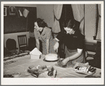 Wife of Jaycee member cutting cake at buffet supper at the high school. Eufaula, Oklahoma. See general caption number 25