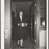 Wife of Jaycee member bringing food to the buffet supper at the high school. Eufaula, Oklahoma. See general caption 25