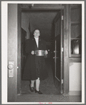 Wife of Jaycee member bringing food to the buffet supper at the high school. Eufaula, Oklahoma. See general caption 25
