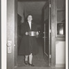 Wife of Jaycee member bringing food to the buffet supper at the high school. Eufaula, Oklahoma. See general caption 25