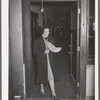 Wife of Jaycee member bringing food to the buffet supper at the high school. Eufaula, Oklahoma. See general caption 25
