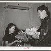 Delivering pie to the young farmer who bid highest. Pie supper in Muskogee County, Oklahoma. See general caption 24