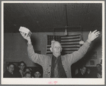 Colonel Lilly auctioning off a piece of cake at pie supper in Muskogee, Oklahoma. See general caption number 24