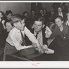 Farm couple with their son at pie supper. McIntosh County, Oklahoma. See general caption number 24