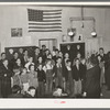 Schoolchildren, directed by their music teacher, sing at the pie supper. McIntosh County, Oklahoma. See general caption number 24