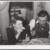 Farm boy eating pie which he bought at auction and which was made by the girl with whom he is eating. Muskogee County, Oklahoma. See general caption number 24