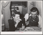 Farm boy eating pie which he bought at auction and which was made by the girl with whom he is eating. Muskogee County, Oklahoma. See general caption number 24