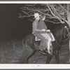 Farm boy and girl riding home after the play party. McIntosh County, Oklahoma. See general caption number 26