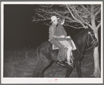 Farm boy and girl riding home after the play party. McIntosh County, Oklahoma. See general caption number 26