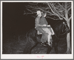 Farm boy and girl riding home after the play party. McIntosh County, Oklahoma. See general caption number 26