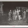 Playing a swing game in the yard. Play party in McIntosh County, Oklahoma. See general caption number 26