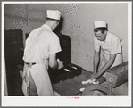 Preparing rolls for baking. Bakery, San Angelo, Texas