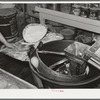Centrifugal machine for forming dough into shape for rolls. Bakery, San Angelo, Texas