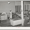 Corner of bakery with machine which forms dough into rolls. Bakery, San Angelo, Texas