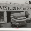 Truck full of mattresses in front of mattress factory. San Angelo, Texas