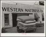 Truck full of mattresses in front of mattress factory. San Angelo, Texas