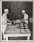 Making and putting pie crusts into pie pans. Bakery, San Angelo, Texas