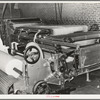 Machine for making cotton bats used for filling mattresses. Mattress factory, San Angelo, Texas