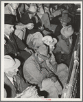 Spectators at livestock auction. San Angelo, Texas