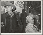 Auctioneer (right) and an official (left) at livestock auction. San Angelo, Texas