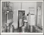 Room where milk is strained and cooled. Large dairy in Tom Green County, Texas