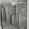 Cartons of groceries in storage at wholesale grocery. San Angelo, Texas