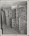 Cartons of groceries in storage at wholesale grocery. San Angelo, Texas