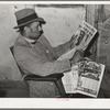 Pomp Hall, Negro tenant farmer, reading newspaper to which he subscribes. Creek County, Oklahoma