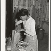 Wife of Pomp Hall, Negro tenant farmer, preparing lunch for her children to take to school. Creek County, Oklahoma