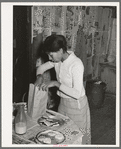 Wife of Pomp Hall, Negro tenant farmer, preparing lunch for her children to take to school. Creek County, Oklahoma