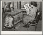 Daughter of Pomp Hall, tenant farmer, reading about chickens in farm magazine. She raises chickens as her 4-H Club project. Creek County, Oklahoma