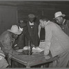 Conference of officials of local chapter of UCAPAWA (United Cannery, Agricutural, Packing, and Allied Workers) of America in Tabor, Creek County, Oklahoma. Pomp Hall, who is leaning on table at right, is an active leader in the union and in his community