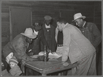 Conference of officials of local chapter of UCAPAWA (United Cannery, Agricutural, Packing, and Allied Workers) of America in Tabor, Creek County, Oklahoma. Pomp Hall, who is leaning on table at right, is an active leader in the union and in his community
