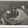 Conference of officials of local chapter of UCAPAWA (United Cannery, Agricutural, Packing, and Allied Workers) of America in Tabor, Creek County, Oklahoma. Pomp Hall, who is leaning on table at right, is an active leader in the union and in his community