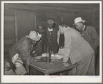 Conference of officials of local chapter of UCAPAWA (United Cannery, Agricutural, Packing, and Allied Workers) of America in Tabor, Creek County, Oklahoma. Pomp Hall, who is leaning on table at right, is an active leader in the union and in his community