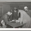 Conference of officials of local chapter of UCAPAWA (United Cannery, Agricutural, Packing, and Allied Workers) of America in Tabor, Creek County, Oklahoma. Pomp Hall, who is leaning on table at right, is an active leader in the union and in his community
