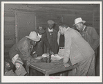 Conference of officials of local chapter of UCAPAWA (United Cannery, Agricutural, Packing, and Allied Workers) of America in Tabor, Creek County, Oklahoma. Pomp Hall, who is leaning on table at right, is an active leader in the union and in his community