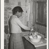 Wife of Pomp Hall, Negro tenant farmer, making biscuits for breakfast. Creek County, Oklahoma