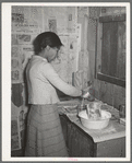 Wife of Pomp Hall, Negro tenant farmer, making biscuits for breakfast. Creek County, Oklahoma