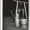 Drawing water from the well in the early morning. Farm of Pomp Hall, Negro tenant farmer. Creek County, Oklahoma