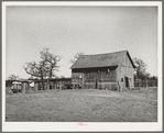 Barn and vegetable stands of Pomp Hall, Negro tenant farmer. During the summer months he sells his produce at this stand on the highway. He also adds to his income by allowing the signs to be painted on his barn which is visible far down the highway. Creek County, Oklahoma