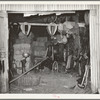 Scene in feed mill and secondhand farm equipment shop. Oklahoma City, Oklahoma