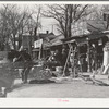 Secondhand row, Oklahoma City, Oklahoma. Oklahoma City seems to have an unusually large number of these cheap secondhand stores, probably because of the floating oil workers and currently shifting populations in surrounding rural areas