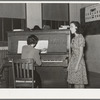 Local singer entertaining at Jaycee buffet supper. Eufaula, Oklahoma. See general caption number 25