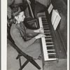 High school girl playing "America the Beautiful" as part of the Americanization program at high school. Eufaula, Oklahoma