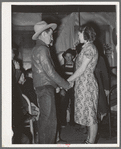 Farm boy and girl playing "Pleased or displeased" at play party in McIntosh County, Oklahoma. See general caption 26