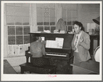 Song director conducting singing of Negro spiritual at soil conservation meeting at Vernon, Oklahoma